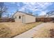 Spacious backyard with a shed, fence and concrete pathway at 2545 W 45Th Ave, Denver, CO 80211