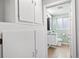 Bathroom with tiled floor, white cabinets, toilet and view into the shower at 2545 W 45Th Ave, Denver, CO 80211