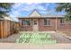 Charming brick home featuring a quaint front entrance and well-maintained landscaping at 2545 W 45Th Ave, Denver, CO 80211