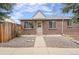 Charming brick home with a well-maintained front yard and inviting entrance at 2545 W 45Th Ave, Denver, CO 80211