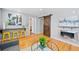 Stylish living area with barn door accent, modern fireplace, and open layout at 2545 W 45Th Ave, Denver, CO 80211
