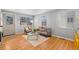 Inviting living room with large windows, comfortable seating, and hardwood floors at 2545 W 45Th Ave, Denver, CO 80211