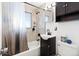 Well-lit bathroom features tiled shower, modern vanity, and updated fixtures, offering a fresh and clean space at 6835 W 55Th Pl, Arvada, CO 80002
