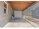 View of a single car carport with concrete floor, tongue and groove roof, and lattice-work at 6835 W 55Th Pl, Arvada, CO 80002