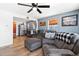 Bright living room featuring comfortable seating, wood floors, and an open floor plan at 6835 W 55Th Pl, Arvada, CO 80002