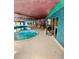 Indoor pool featuring a jacuzzi tub, grill, and a surrounding turquoise and purple color scheme at 1302 S Parker Rd # 316, Denver, CO 80231