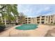 Apartment complex community pool with mature trees and green space at 1302 S Parker Rd # 316, Denver, CO 80231