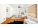 Bright bedroom with a ceiling fan, a large window, hardwood floors and stylish decor at 1256 N Emerson St, Denver, CO 80218