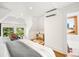 Bedroom with hardwood floors, large windows, and a cozy reading nook at 1256 N Emerson St, Denver, CO 80218