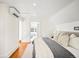 Bright bedroom featuring hardwood floors, neutral decor, and a comfortable bed at 1256 N Emerson St, Denver, CO 80218