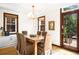Dining room with natural light, wood floors, and view to the back at 1256 N Emerson St, Denver, CO 80218