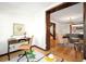 Inviting home office with dark wood desk and view to living room, bright and fresh feel at 1256 N Emerson St, Denver, CO 80218
