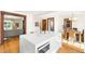 Open kitchen layout with stone countertops, stainless appliances, and an island at 1256 N Emerson St, Denver, CO 80218