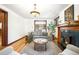 Bright living room featuring hardwood floors, comfortable seating, and an inviting fireplace at 1256 N Emerson St, Denver, CO 80218