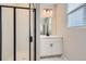 Modern bathroom with white vanity and glass shower at 9633 Browns Peak Cir, Littleton, CO 80125