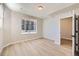 Spacious bedroom with hardwood floors and large window at 9633 Browns Peak Cir, Littleton, CO 80125