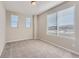 Bright bedroom with neutral walls and carpet at 9633 Browns Peak Cir, Littleton, CO 80125