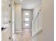 Light and bright entryway with stairs and hardwood floors at 9633 Browns Peak Cir, Littleton, CO 80125