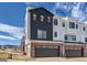 Two-story home with dark and light siding and garage at 9633 Browns Peak Cir, Littleton, CO 80125