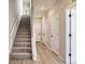 Hallway with carpeted stairs and hardwood floors at 9633 Browns Peak Cir, Littleton, CO 80125