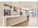 Modern kitchen with island and stainless steel appliances at 9633 Browns Peak Cir, Littleton, CO 80125