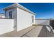 Private rooftop deck with white siding and city views at 9633 Browns Peak Cir, Littleton, CO 80125