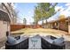 A well maintained backyard featuring a gravel area with seating perfect for outdoor enjoyment at 3925 Newland St, Wheat Ridge, CO 80033