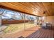 A spacious covered patio overlooking a large backyard perfect for outdoor entertaining and relaxation at 3925 Newland St, Wheat Ridge, CO 80033