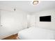 A bedroom featuring white walls, a bed, and a closet with sliding doors at 3925 Newland St, Wheat Ridge, CO 80033