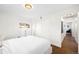 Bedroom featuring a bed, hardwood floors, a closet with sliding doors, and a dresser at 3925 Newland St, Wheat Ridge, CO 80033