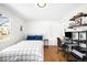 Bedroom featuring hardwood floors, natural light, a desk, and modern finishes at 3925 Newland St, Wheat Ridge, CO 80033
