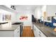 Modern kitchen with stylish backsplash, stainless steel appliances, and bar seating at 3925 Newland St, Wheat Ridge, CO 80033