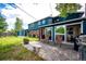 Spacious backyard features a patio area with a grill, seating, and a lush lawn at 4645 W Temple Pl, Denver, CO 80236