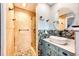 Stylish bathroom with stone shower and modern vanity at 4645 W Temple Pl, Denver, CO 80236