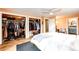 Bedroom with built-in closet, wood floors and a view of the ensuite bathroom at 4645 W Temple Pl, Denver, CO 80236