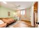 Comfortable bedroom with wood floors, ceiling fan, closet and natural light at 4645 W Temple Pl, Denver, CO 80236