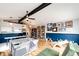 Open living room with hardwood floors, shelving, ceiling fan, and a area at 4645 W Temple Pl, Denver, CO 80236