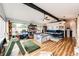 Bright living room with hardwood floors, a large window, and vaulted ceilings at 4645 W Temple Pl, Denver, CO 80236