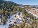 Gorgeous custom mountain home tucked among the pines with an attached two car garage and spacious driveway at 1053 Red Moon Rd, Evergreen, CO 80439