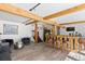 Basement with a custom bar, wood-look floors, and ample seating at 1053 Red Moon Rd, Evergreen, CO 80439