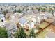 Aerial view of house with solar panels and neighborhood at 9488 Brook Ln, Lone Tree, CO 80124