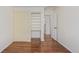 Bedroom with wood floors and a built-in shelving at 9488 Brook Ln, Lone Tree, CO 80124