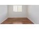 Small bedroom with wood floors and a window at 9488 Brook Ln, Lone Tree, CO 80124