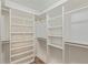 Spacious walk-in closet with shelves and hanging rods at 9488 Brook Ln, Lone Tree, CO 80124