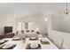 Virtually staged dining room with a table set for dinner at 9488 Brook Ln, Lone Tree, CO 80124