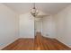 Bright hallway with hardwood floors and access to other rooms at 9488 Brook Ln, Lone Tree, CO 80124