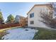 Back of house with deck and stairs leading to the yard at 9488 Brook Ln, Lone Tree, CO 80124