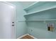 Laundry room with shelving and built in storage at 9488 Brook Ln, Lone Tree, CO 80124