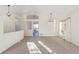 Living room with high ceilings, neutral walls and carpet at 9488 Brook Ln, Lone Tree, CO 80124