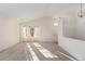 Bright living room with large windows and neutral tones at 9488 Brook Ln, Lone Tree, CO 80124